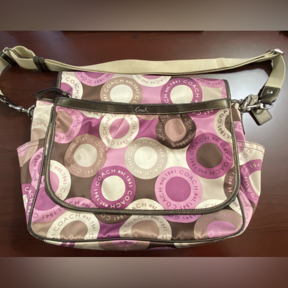 Coach Diaper Bag w/fold over snap head closure.